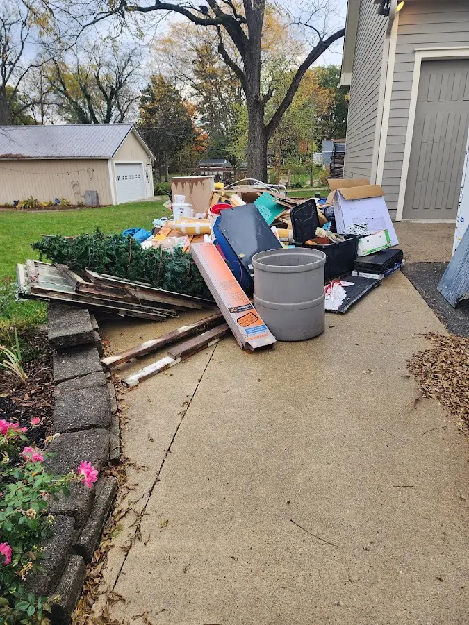 Dumpster being loaded with debris for Commercial Dumpster Rental in Moreau